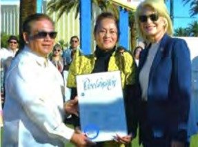 A Clark County proclamation recognizing Filipino American History Month is presented to NaFFAA Nevada at the Welcome to Fabulous Las Vegas sign