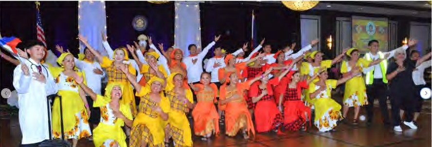 Dancers in yellow and orange costumes perform at the 2026 Filipino American Heritage Foundation Gala in Las Vegas
