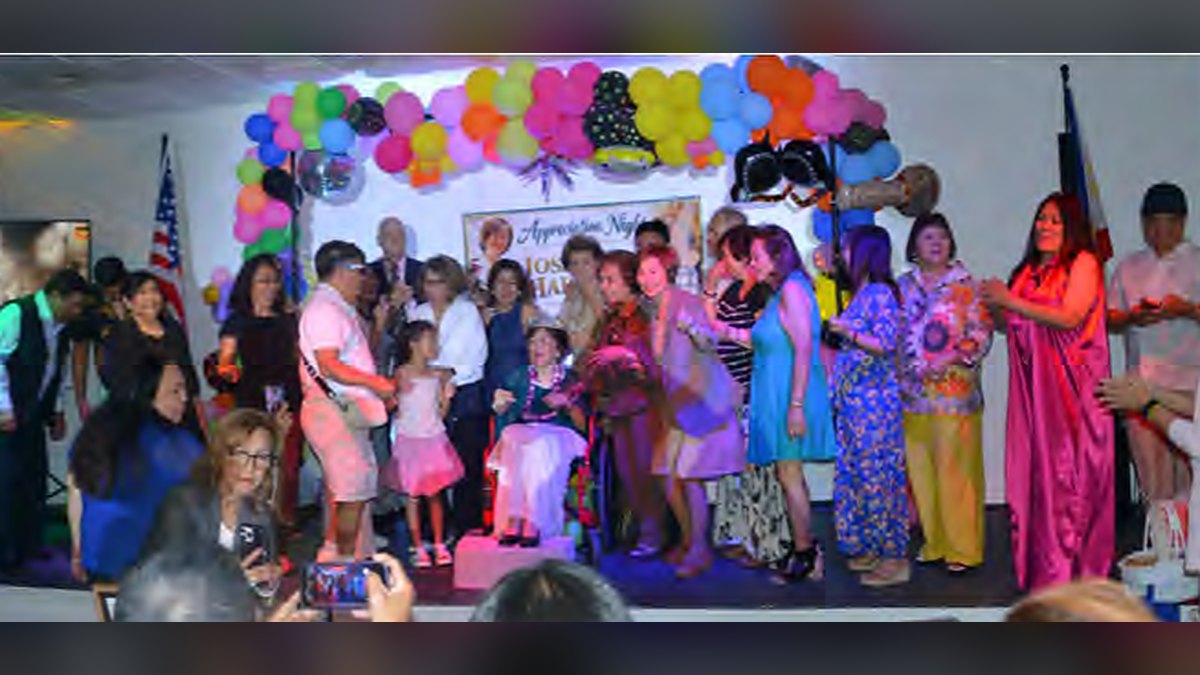 Celebrants gather around Josie Harrison, mother of comedian Jo Koy, at her Appreciation Night in Las Vegas