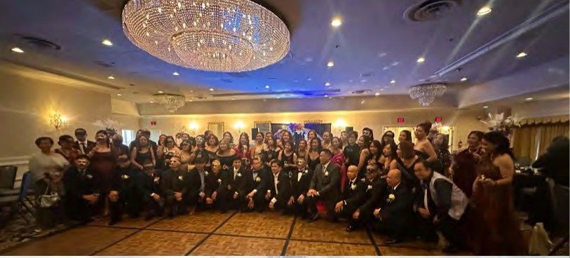 Nursing Class of 1993 alumni in formal wear at their reunion gala in a ballroom at Horseshoe Las Vegas